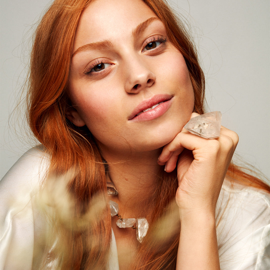 Model wearing the Not a Pearl Necklace Rough Quartz Point by Märta Larsson with a matching crystal ring, styled for confident natural elegance.