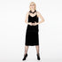 Front view of a model wearing the Paradis Camisole by Märta Larsson, photographed against a white background. This silk satin camisole top for women features a scoop neckline and skinny straps, offering a relaxed fit and luxurious feel. A perfect designer camisole for layering or styling with wide-leg pants.