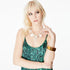 Front view of a model wearing the Paradis Silk Satin Camisole by Märta Larsson, photographed against a white background. This luxury camisole top for women features a scoop neckline and skinny straps, crafted in 100% silk satin. A modern designer camisole perfect for layering with fashion jewelry or styling for elegant nights out.