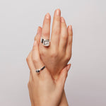  Close-up of Power Ring in brushed silver, highlighting the faceted surface and confident, minimalist design.