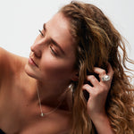 Portrait featuring Power Ring by Märta Larsson, paired with sculptural jewelry and natural styling for a confident look.