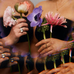 Artistic composition of Power Ring worn with floral elements, blending raw silver design with expressive styling.