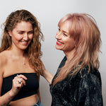 Model wearing the Rolling Stone Necklace by Märta Larsson with voluminous hair, a raw crystal silver piece styled for minimalist modern elegance.