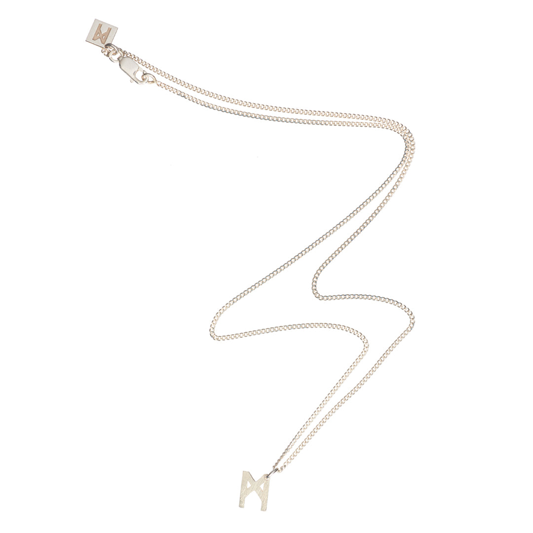 Signature Necklace Brushed Silver by Märta Larsson with M logo charm on recycled sterling silver chain, a minimalist brushed silver initial piece.