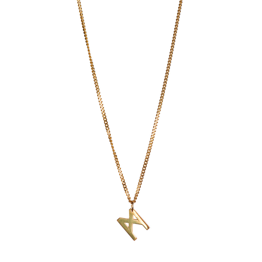 Signature Necklace by Märta Larsson in polished gold vermeil with M-logo charm, a minimalist recycled-silver pendant handcrafted in Stockholm.