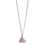 The Raw One Rose Quartz Necklace by Märta Larsson in silver with raw pink crystal pendant, a minimalist rose quartz piece with natural texture.