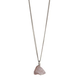 The Raw One Rose Quartz Necklace by Märta Larsson in silver with raw pink crystal pendant, a minimalist rose quartz piece with natural texture.