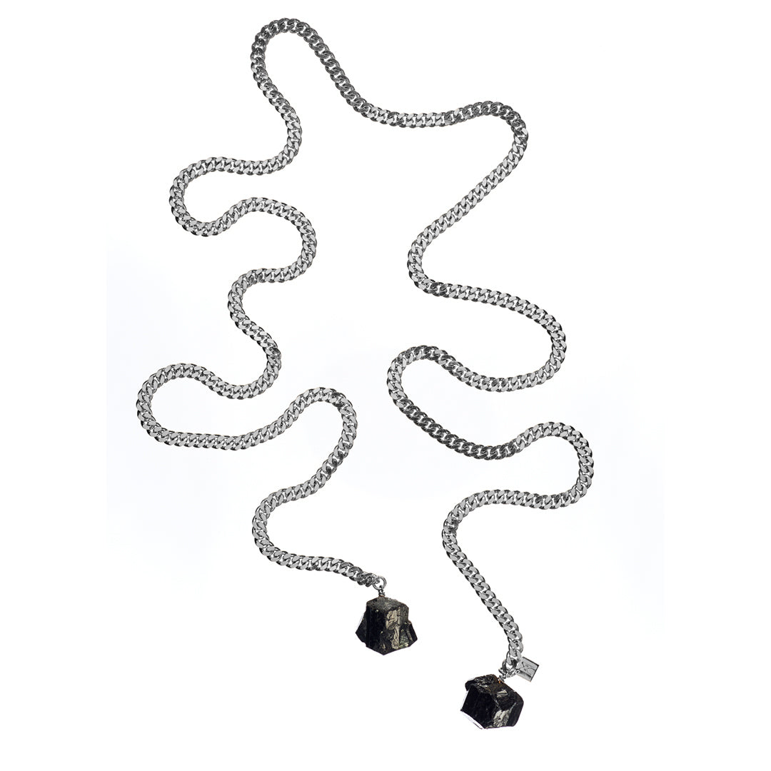 Tie Me Up Black Tourmaline Necklace by Märta Larsson in silver, a rugged raw tourmaline pendant necklace on a serpentine chain for edgy modern style.