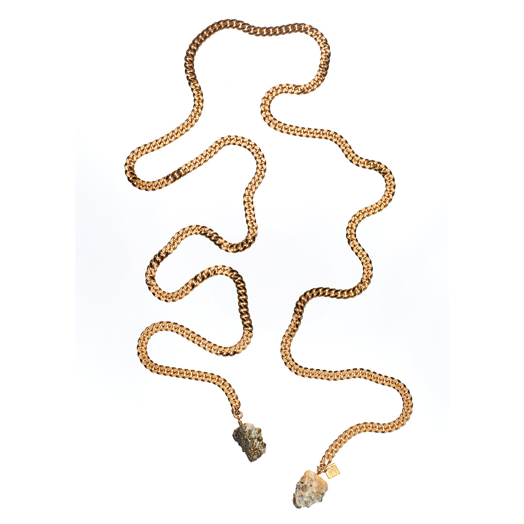 Tie Me Up Calcite Pyrite Necklace by Märta Larsson with raw quartz pendants on a gold-plated lariat chain, a bold sculptural handcrafted piece.